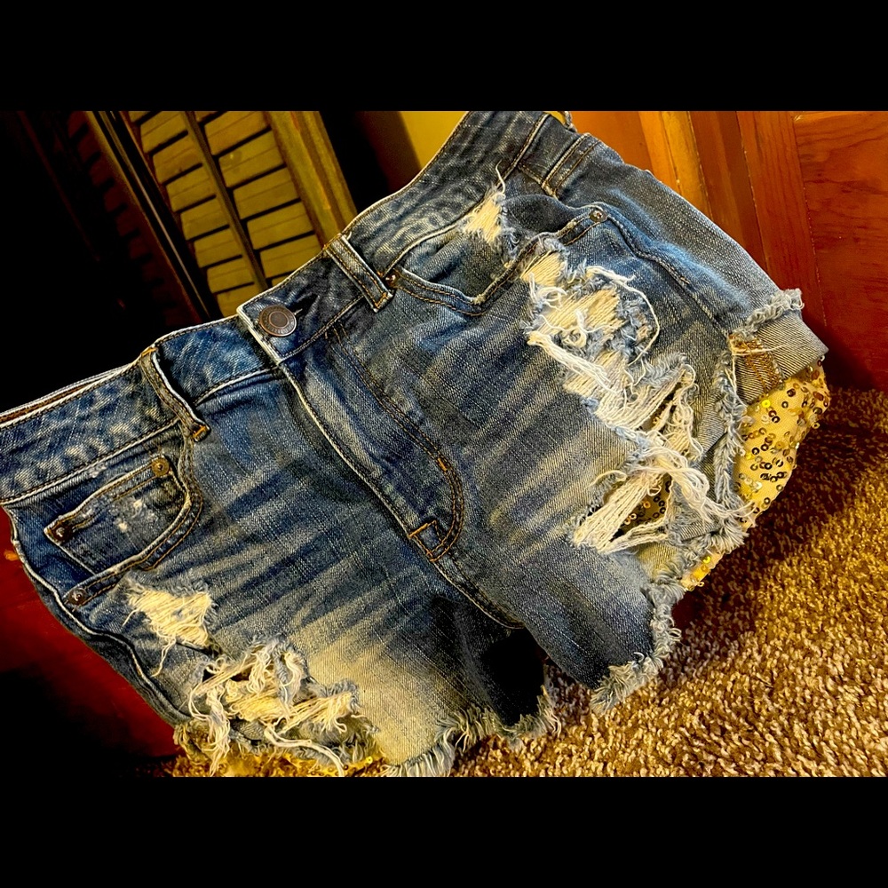 American Eagle Outfitters jean shorts (8) with gold sequence pockets. Note flaw